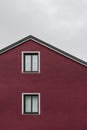 Facade and roof of a dark red house Royalty Free Stock Photo