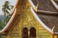 Facade and roof decoration of the Haw Pha Bang Buddhist temple at the Royal Palace Museum in Luang Prabang, Laos. Royalty Free Stock Photo