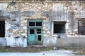 Facade of a ruined and dilapidated stone building. Royalty Free Stock Photo