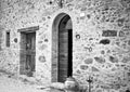 The facade of a rural stone farmhouse with wooden doors and windows in the italian countryside Tuscany, Italy Royalty Free Stock Photo