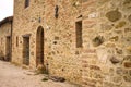 The facade of a rural stone farmhouse with wooden doors and windows in the italian countryside Tuscany, Italy Royalty Free Stock Photo