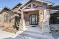 Facade of a rustic bungalow house with stone walls