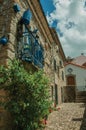 Facade of a rustic stone house with decorated balcony Royalty Free Stock Photo