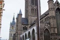 Facade of Saint Nicholas` Church Sint-Niklaaskerk with the Belfry Het Belfort at the background in Ghent, Belgium, Europe Royalty Free Stock Photo