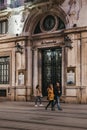 Facade of Santander bank branch in Seville, Spain, people walk by, motion blur Royalty Free Stock Photo
