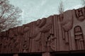 Facade with sculptures of the musical school in Pripyat, red toned