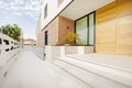 Facade of a single-family house with oak doors, white marble steps Royalty Free Stock Photo