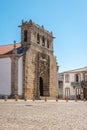 Facade of the sixteenth century Gothic Manueline church with a three bells belfry, in the town of Vila Nova de Foz Coa, Portugal