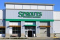 Facade of Sprouts Farmers Market grocery store with signage in brand color