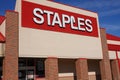 The facade of a Staples store with it`s large red sign with white littering seen from the parking lot Royalty Free Stock Photo