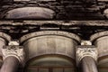 Facade of a stone antique building. sculptures on the wall. stone texture