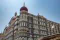 Facade of The Taj Mahal Palace hotel in Colaba district. Taj Mahal hotel famous building of touristic part in Mumbai Royalty Free Stock Photo