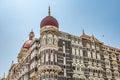 Facade of The Taj Mahal Palace hotel in Colaba district. Taj Mahal hotel famous building of touristic part in Mumbai Royalty Free Stock Photo