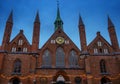 Facade and towers of the Holy Spirit Hospital, named Heiligen Geist Hospital in the old town of Luebeck, a historic brick building