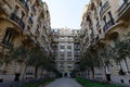 The facade of traditional French house with typical balconies and windows. Paris.