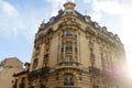 The facade of traditional French house with typical balconies and windows. Paris.