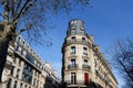 The facade of traditional French house with typical balconies and windows. Paris Royalty Free Stock Photo