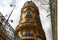 The facade of traditional French house with typical balconies and windows. Paris. Royalty Free Stock Photo