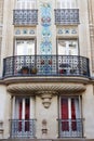 The facade of traditional French house with typical balconies and windows. Paris. Royalty Free Stock Photo