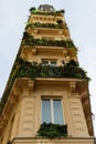 The facade of traditional French house with typical balconies and windows. Paris. Royalty Free Stock Photo