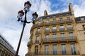 The facade of traditional French house with typical balconies and windows. Paris. Royalty Free Stock Photo