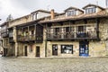 Facade with traditional wooden galleries in brown Comillas Cantabria Spain