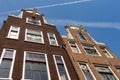 The facade of two historical Dutch houses.