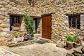 Facade of a typical house made of stone in the mountains of Catalonia, Beget, Girona. Royalty Free Stock Photo