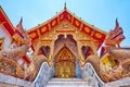 Naga serpents and gilt facade of Ubosot in Wat Thung Yu, Chiang Mai, Thailand