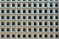Facade of urban skyscraper rows of square geometric pattern windows