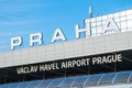 Facade of Vaclav Havel airport building under clear blue sky