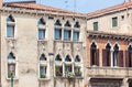 Facade of venetian houses with typical old venetian windows. Venice, Italy Royalty Free Stock Photo