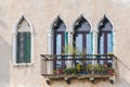 Facade of venetian houses with typical old venetian windows. Venice, Italy Royalty Free Stock Photo