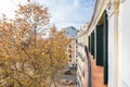 Facade of a vintage house in a square with gardens and long-lived trees Royalty Free Stock Photo