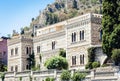 Facade wall of old baroque palace building in Taormina, traditional architecture of Sicily, Italy Royalty Free Stock Photo