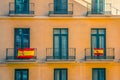 Facade with windows and spanish flags