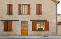 Facade wood shutters and flowers Cajarc France Royalty Free Stock Photo