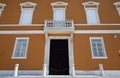 Facade, wooden door and symmetrical windows