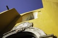 Facade of a yellow colonial style church in San Miguel de Allende, Guanajuato, Mexico