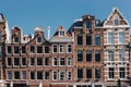 facades of ancient buildings on street of Amsterdam on sunny