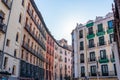 Facades of buildings in the center of Madid, typical houses with their balconies and barred windows.