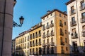 Facades of buildings in the center of Madid, typical houses with their balconies and barred windows.