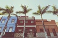 Facades of colourful houses and palm trees on typical canarian street, Puerto de La Cruz, Tenerife, Spain Royalty Free Stock Photo