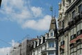 Facades of historical residential buildings in Zurich city center, some of them in redecoration, covered by protective net