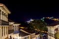 Facades of houses in colonial architecture on an old cobblestone street in the city of Ouro Preto at night Royalty Free Stock Photo