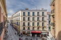 Facades of old buildings making corners in narrow streets