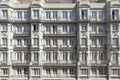 Facades of old stately urban residential apartment buildings with many balconies, bay windows and windows with balustrades and Royalty Free Stock Photo