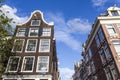 Facades of the old 17th century houses along the Prinsengracht canal in Amsterdam - Holland Royalty Free Stock Photo