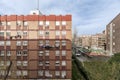 Facades of residential buildings with terracotta bricks with large green areas Royalty Free Stock Photo