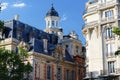 The facades of traditional French houses with typical balconies and windows. Paris.